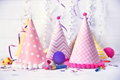 Birthday party caps on wooden background.jpg